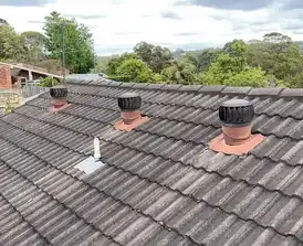 Residential roof after complete painting and maintenance service