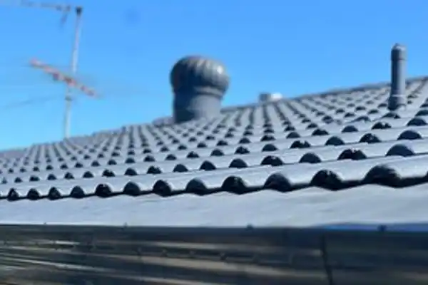 Close-up of a freshly restored roof with high-quality roofing materials and coatings