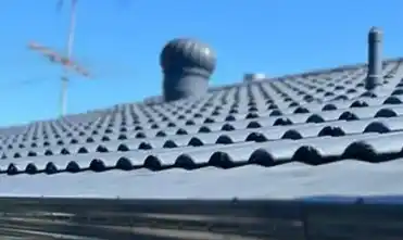 Close-up of a freshly restored roof with high-quality roofing materials and coatings