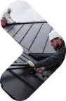 Professional roofing service team inspecting and repairing a roof